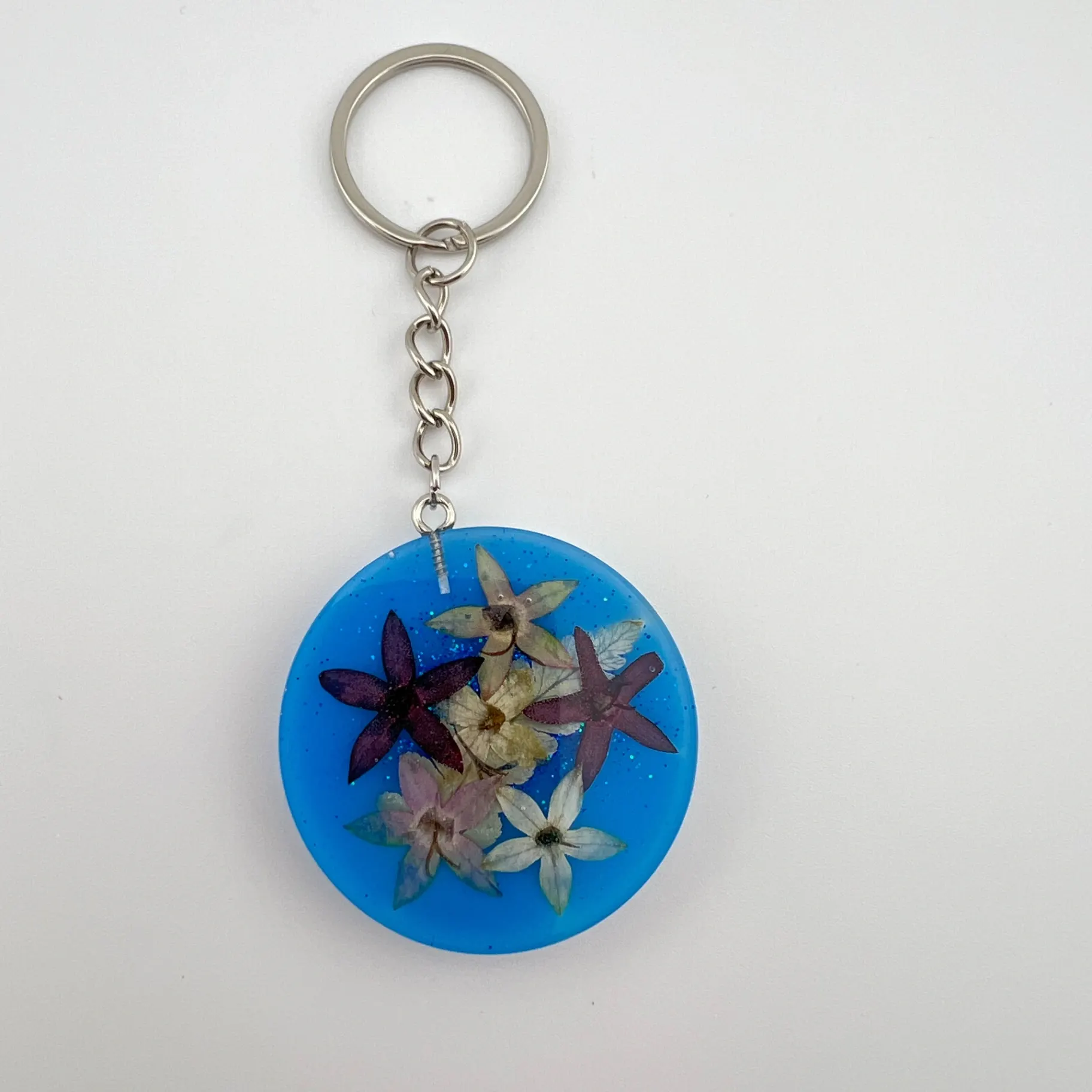 Přívěsek, pryskyřice, kolečko modré s květy
